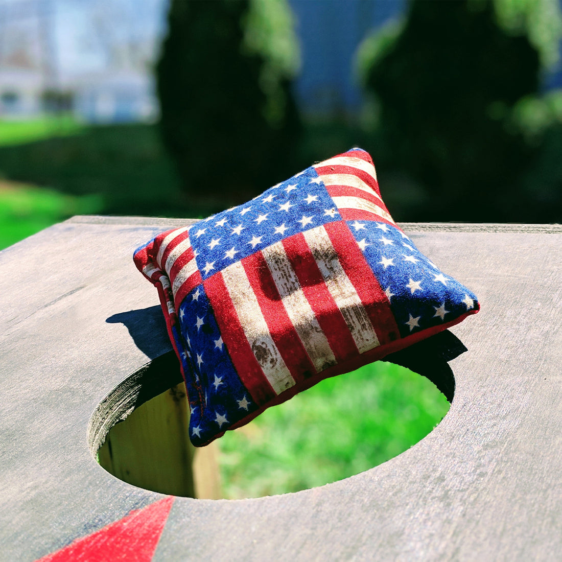 bean bag on top of a corn hole board outdoor fourth of july games