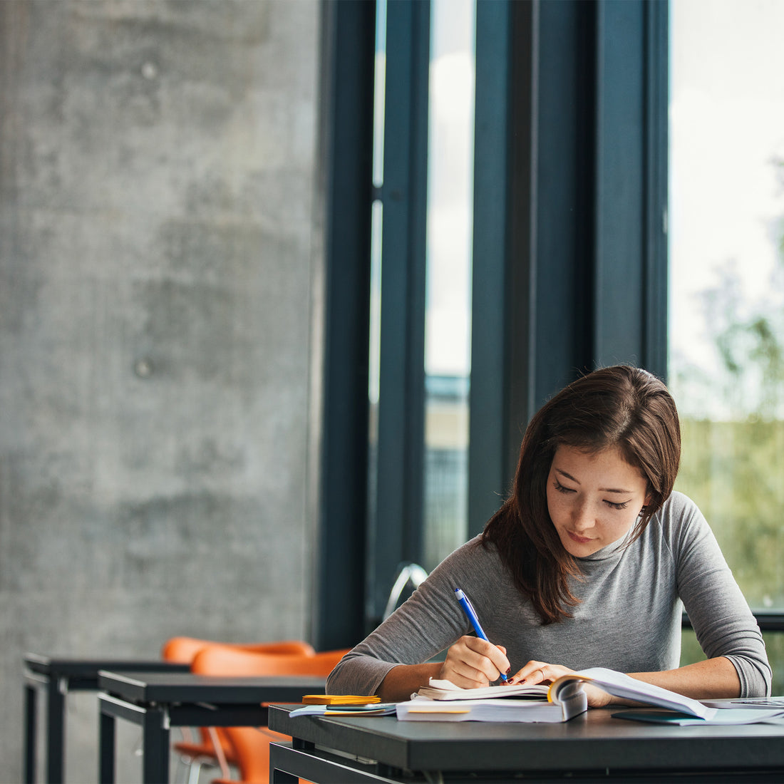 Asian student studying in a library