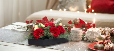 holiday christmas tablescape red rose and  candles decor 